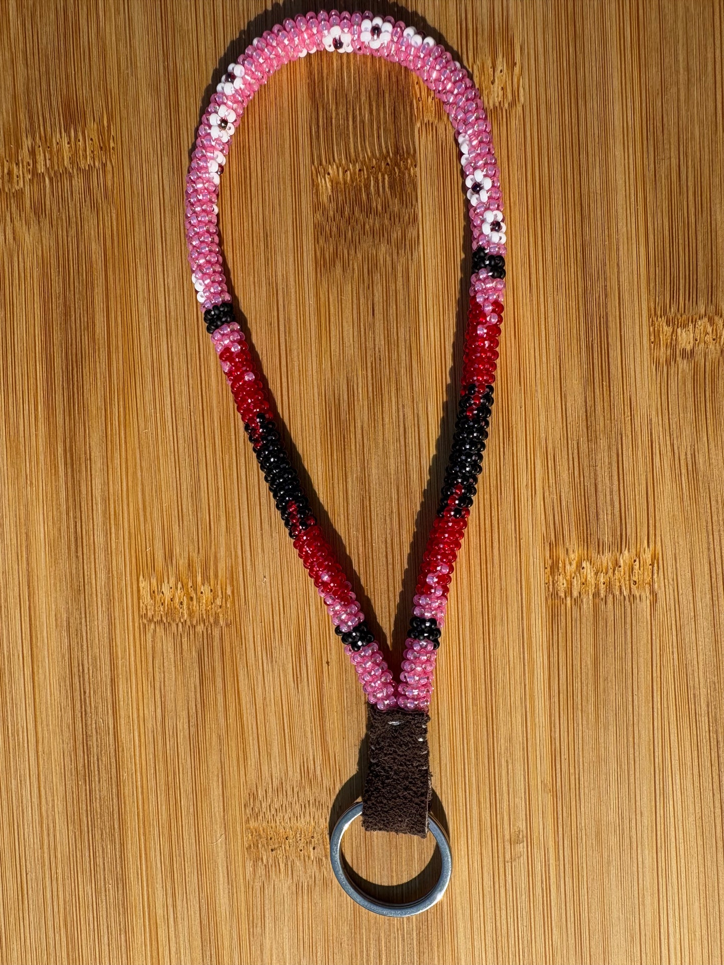 Pink and Red Beaded Wristlet with White Flowers