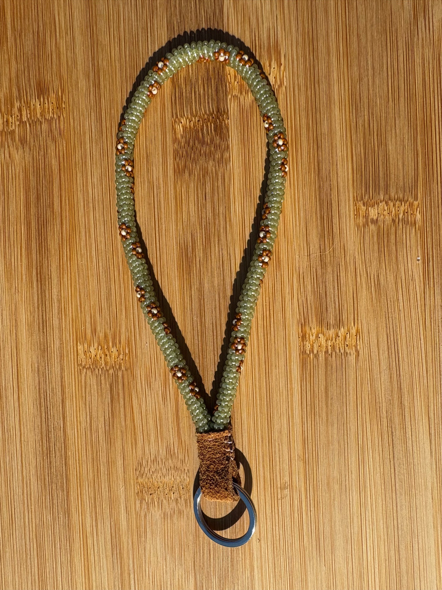 Green Beaded Wristlet with Brown Flowers